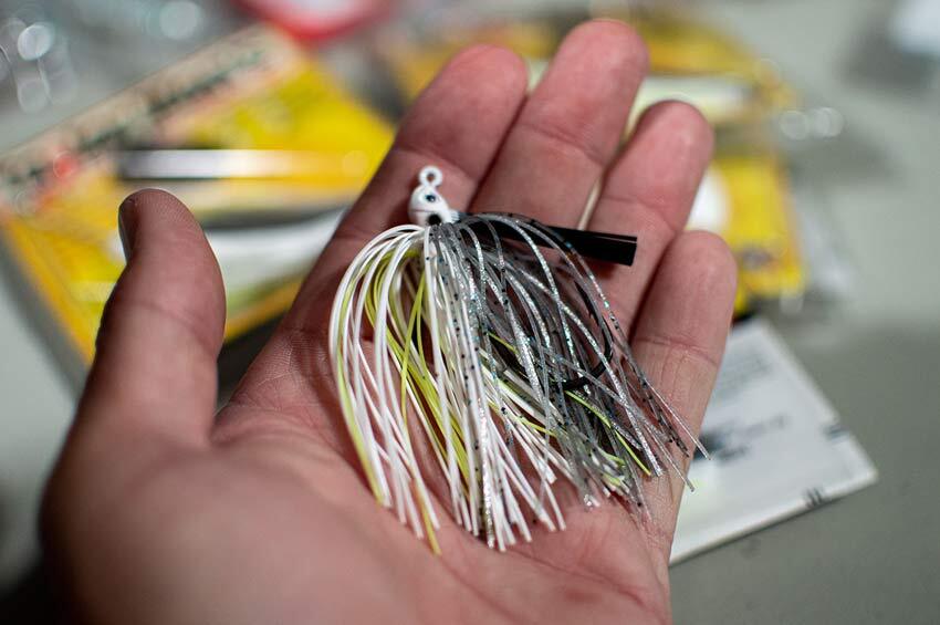 A Swim jig laying in a man's hand