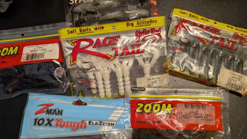 assortment of swim jig trailers from various brands in the packages viewed from above